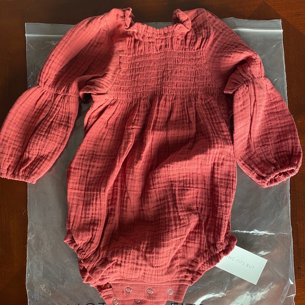 Nothing Fits ruffled onesie rust colored.